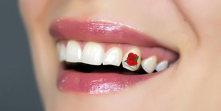 rose tooth tattoo